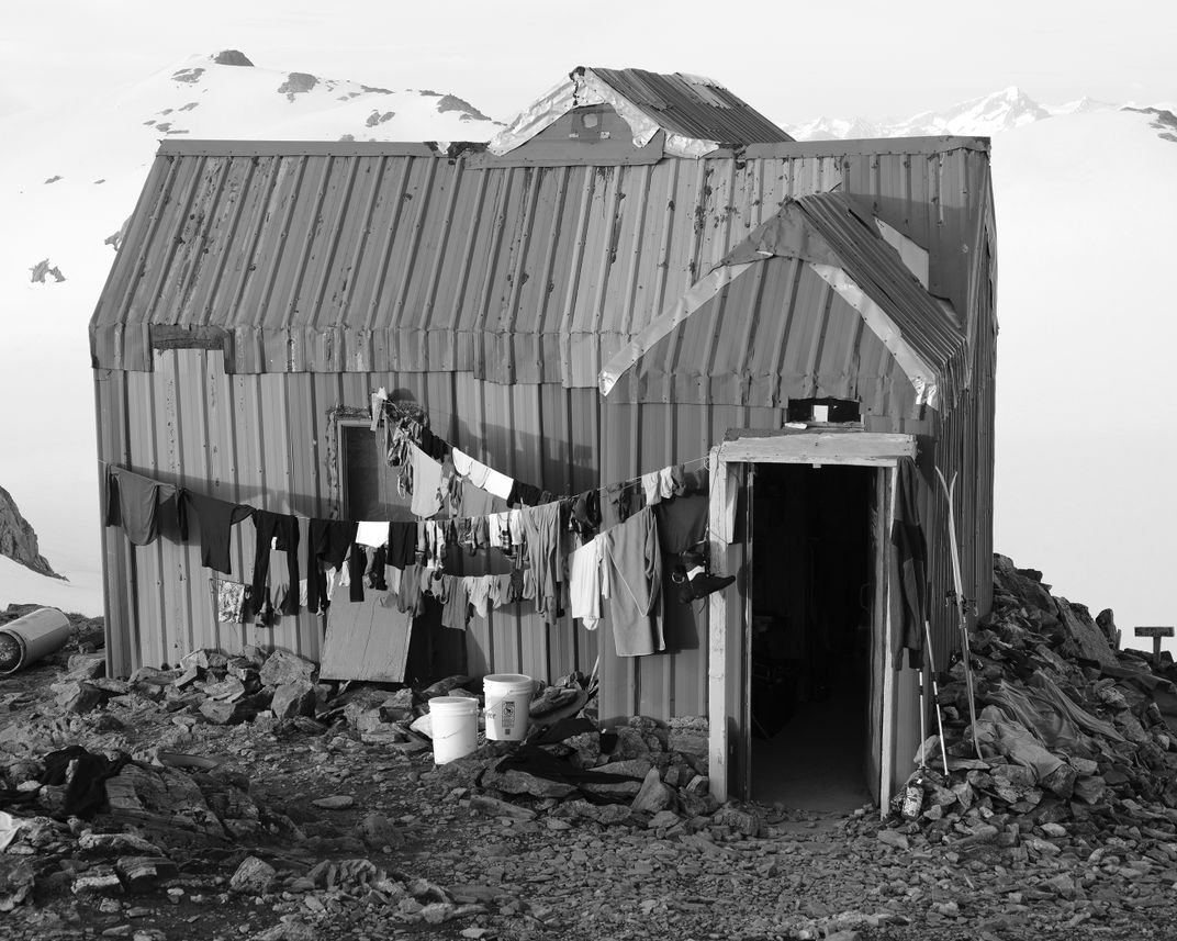 Clothes and gear dry outside at Camp 17. In the absence of running water, participants use melted snow for laundry and bathing.