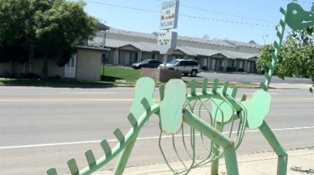 A metallic, skeletal "Brontosaurus" at a Blanding, Utah Sinclair station