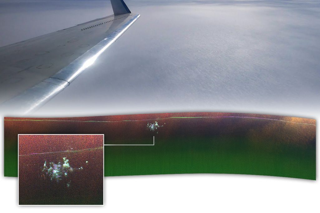 a view out the window of an airplane, with the bottom part shown in radar, depicting a lot of dots concentrated in one area