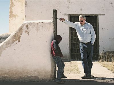 In Janos, Mexico, Mormon guide John Hatch chats with a youngster at a 17thcentury Catholic church.