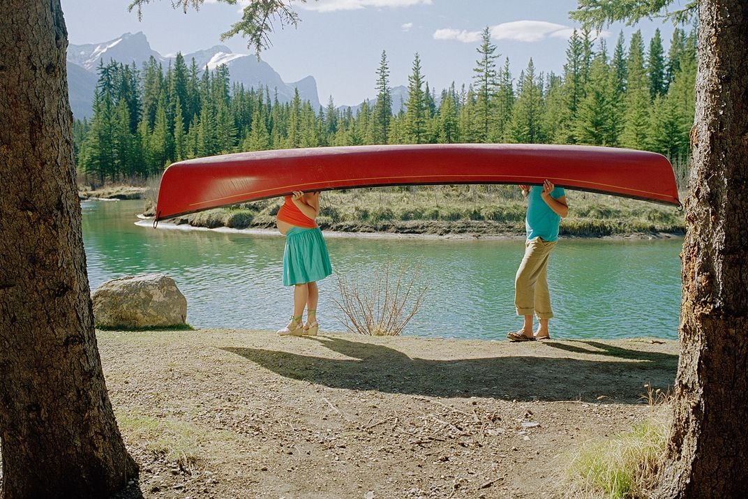 Women Carrying Canoe