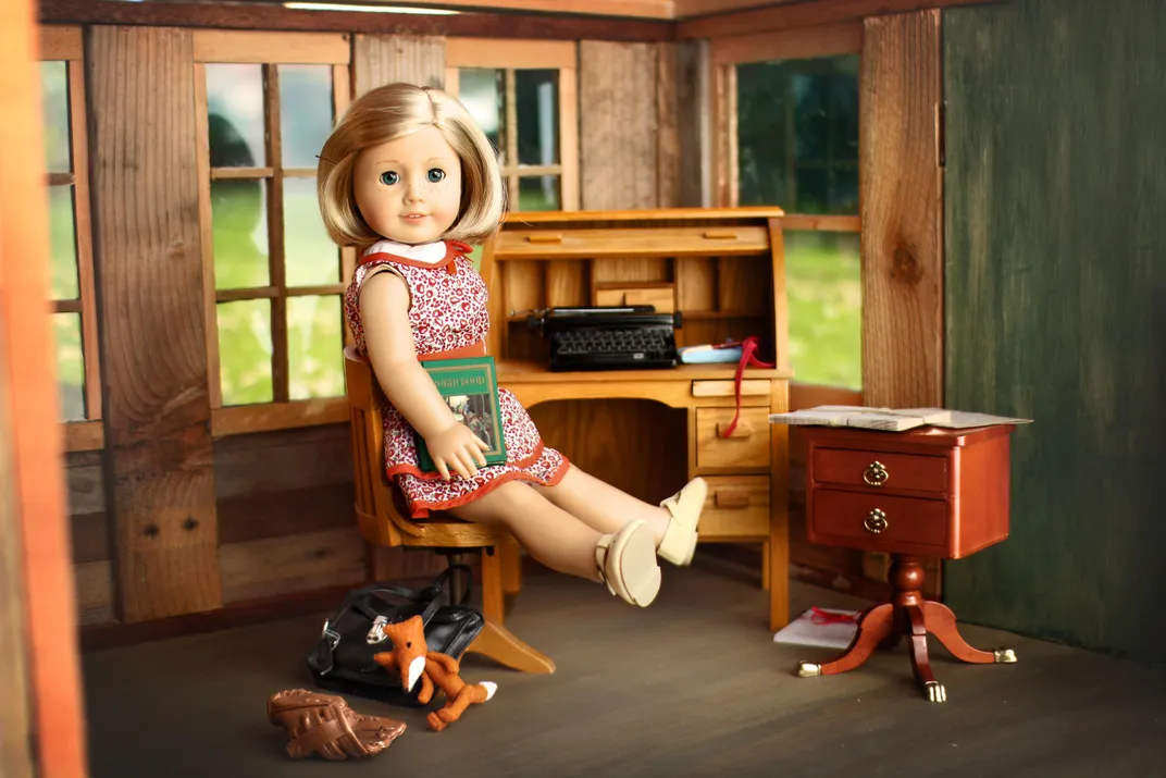 Kit Kittredge doll sitting at her desk in makeshift attic