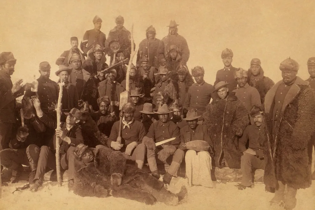 Buffalo soldiers of the 25th Infantry, some wearing buffalo robes, Ft. Keogh, Montana