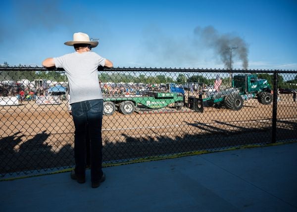 A Young Man At The Annual Tractor Pull thumbnail