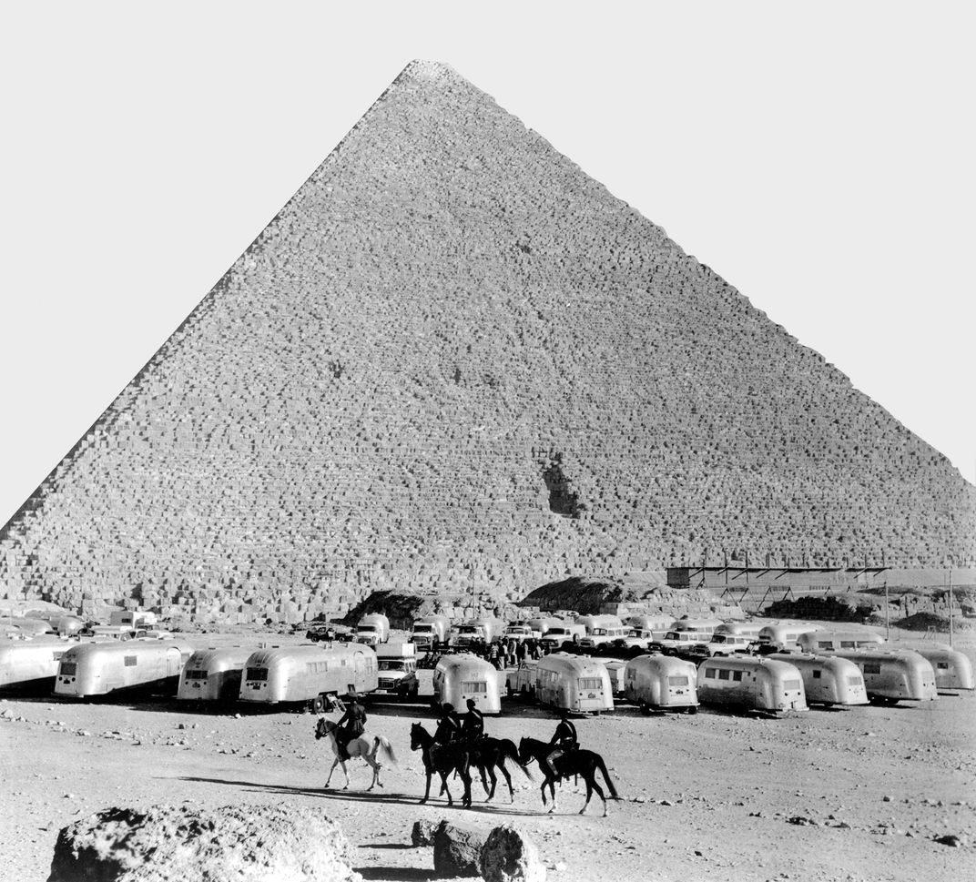 airstream campers lined up in front of a Pyramid at Giza near Cairo in 1960