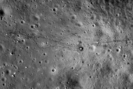 The Apollo 17 landing site, as photographed by the Lunar Reconnaissance Orbiter in 2009 and 2011. To the left of Challenger&rsquo;s descent stage (just right of center) are the astronauts' footpaths. To the right are tracks left by their moon buggy.
