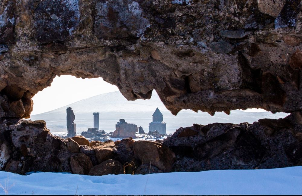 The ancient Armenian city "Ani City" from the hole in a rock.