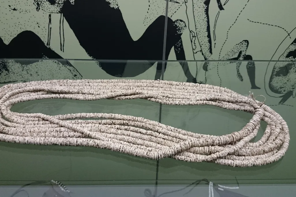 several necklaces of ostrich beads