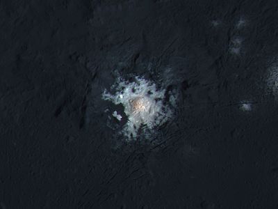 The bright spots of Occator Crater are shown in enhanced color in this view from NASA's Dawn spacecraft.