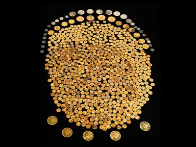 The 700-plus gold coins, found in a cornfield in Kentucky, date to between 1840 and 1863.
