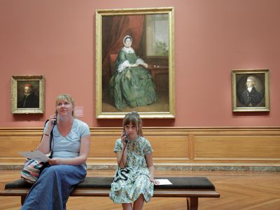 Mother and daughter listen to an audio tour at the Baltimore Museum of Art.