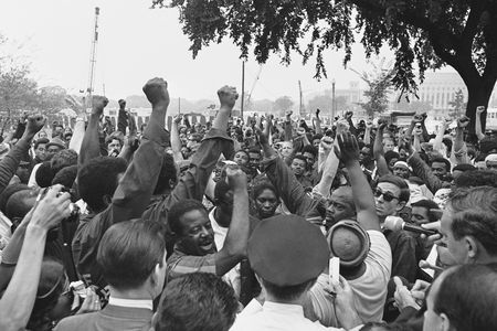 Civil rights leader Rev. Ralph Abernathy, in short sleeves, leads the Poor People's March to the edge of the grounds of the U.S. Capitol building in Washington, June 24, 1968. Abernathy and his followers from Resurrection City marched to the Agriculture Department and then to the Capitol. 