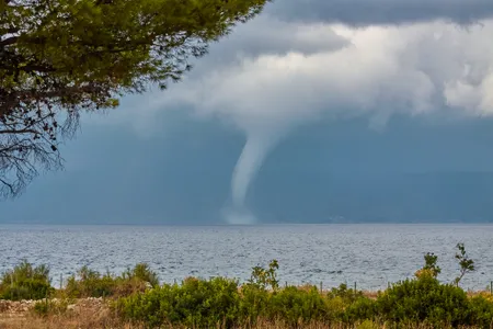 A waterspout photographed in the Adriatic Sea near Brac Island, Croatia, like the one implicated in sinking a yacht in Sicily this week. These sudden, violent storms are hard to predict and can occur more often in warmer waters heated by climate change.