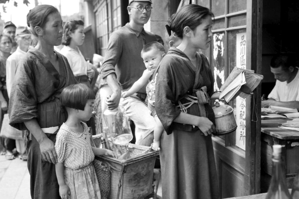 People lining up for rations of beans in Japan