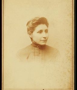 Black and white portrait of Susan La Flesche Picotte on a photo card from the shoulders up.