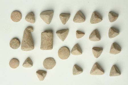 Clay tokens that Assyrians used for a simple bookkeeping system.   