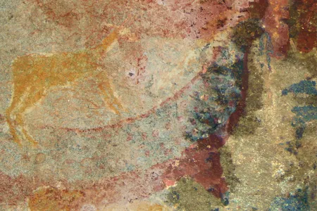 The Horned Serpent Panel, painted by the San people in southern Africa, shows a mysterious creature's tusks in blue at the upper right.