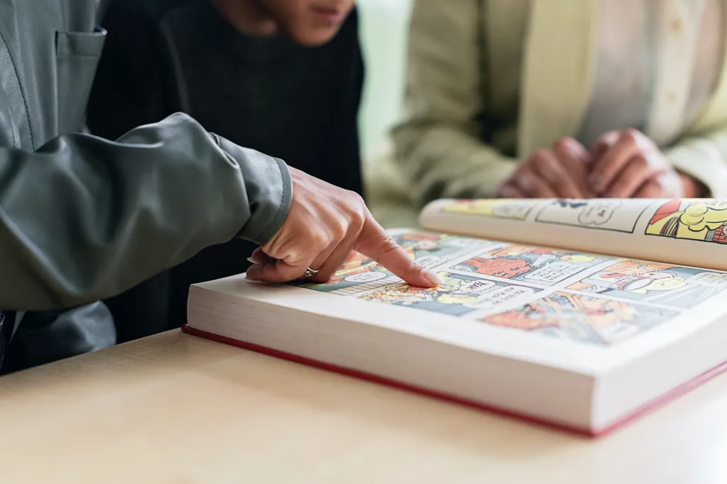 Person looking at comic book