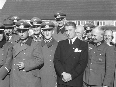 Wernher von Braun (in suit) with German officers in 1941.