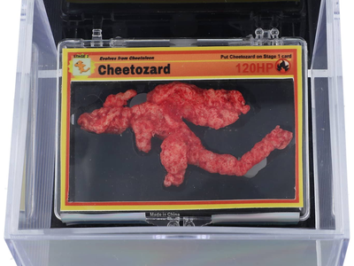 The three-inch Flamin&#39; Hot Cheeto was sold in a custom case with a&nbsp;custom Cheetozard Pok&eacute;mon card.