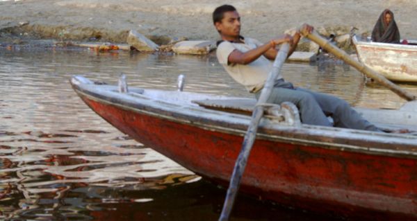 Man rowing along the Ganges River thumbnail