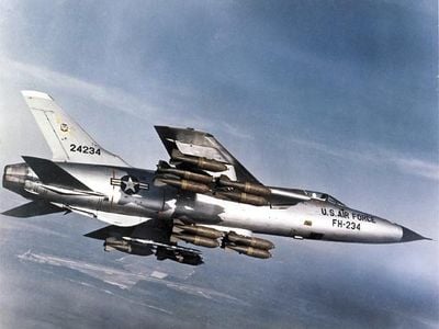 During a flight demonstration Stateside, an F-105 carries a full bomb load: 16 750-pounders. While attacking targets in Vietnam, though, Thuds were generally outfitted with 6,000 pounds of bombs and two auxiliary fuel tanks.