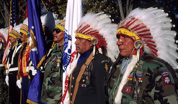 Native American veterans of the Vietnam War stand in honor as part of the color guard at the Vietnam Veterans War Memorial. November 11, 1990, Washington, D.C.  (Photo by Mark Reinstein/Corbis via Getty Images)