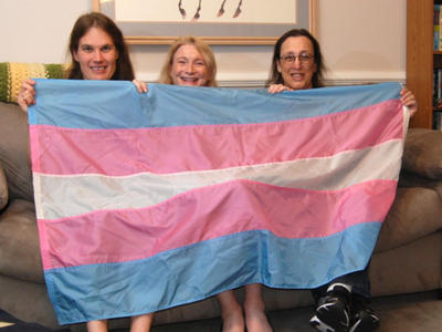Transgender flag designed by Monica Helms (right), and friends. The flag's stripes represent the traditional pink and blue associated with girls and boys and white for intersex, transitioning, or of undefined gender. Helms served in the United States Navy and became an activist for transgender rights in the late 1990s in Arizona where she grew up. She designed the flag in 1999. (NMAH)