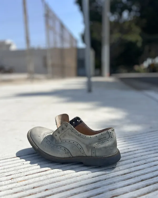 Modern Mysteries: Abandoned Shoe on the Sidewalk thumbnail