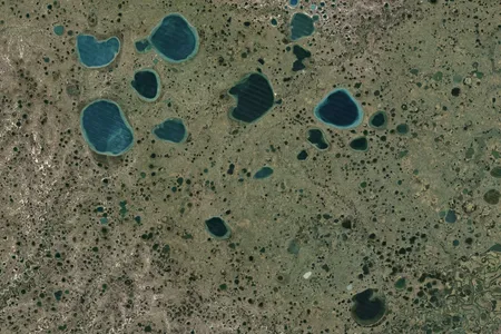 The small lakes that dot Russia's Yamal Peninsula were likely formed in the same was as the two strange holes.