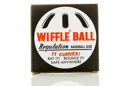 The Wiffle Ball comes with slots on one side to make it easier to throw curves and other pitches.