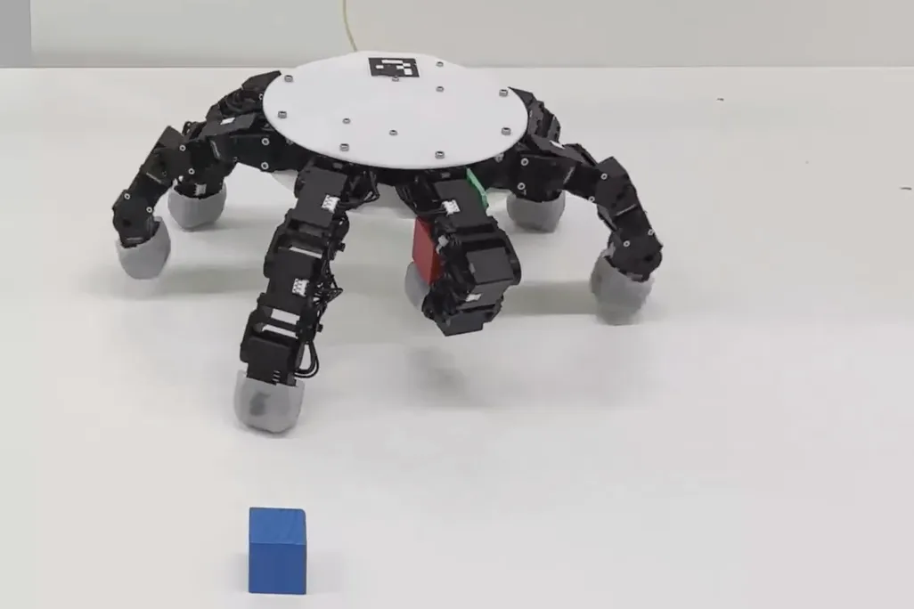 a six-fingered robot on a table
