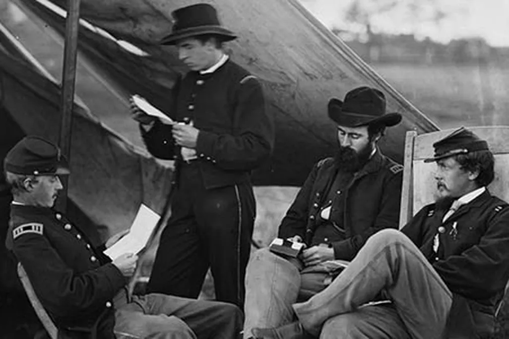 Civil War soldiers reading letters from home