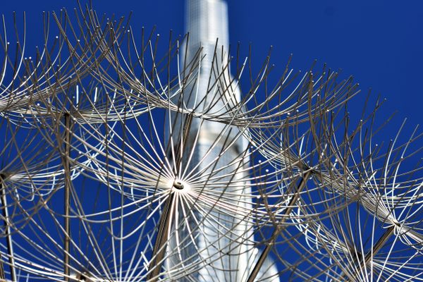 Metal spider sculptures against the Burj Khalifa thumbnail