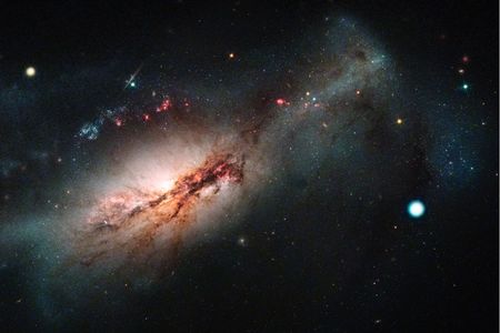The supernova SN2018zd (large white dot on the right) located 30 to 40 million light years away was first identified in 2018 and may be the first observed evidence of an electron-capture supernova. 
