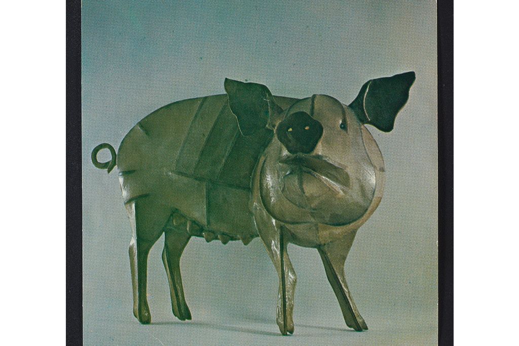 sculptures of animals in metal and wood