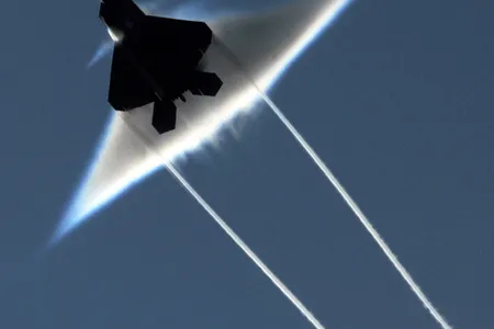 090622-N-7780S-014
GULF OF ALASKA (June 22, 2009) An Air Force F-22 Raptor executes a supersonic flyby over the flight deck of the aircraft carrier USS John C. Stennis (CVN 74). John C. Stennis is participating in Northern Edge 2009, a joint exercise focusing on detecting and tracking units at sea, in the air and on land. (U.S. Navy photo by Sonar Technician (Surface) 1st Class Ronald Dejarnett/Released)