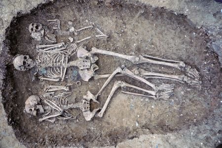 Grave 109 at Oakington is a rare triple burial, holding the remains of a female infant, a young woman (left) and an older woman (center).&nbsp;