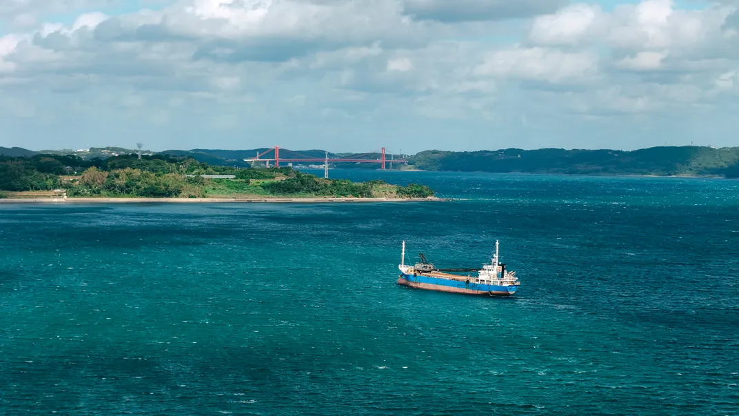 A ship’s blue hull contrasts beautifully with the deep-blue water.