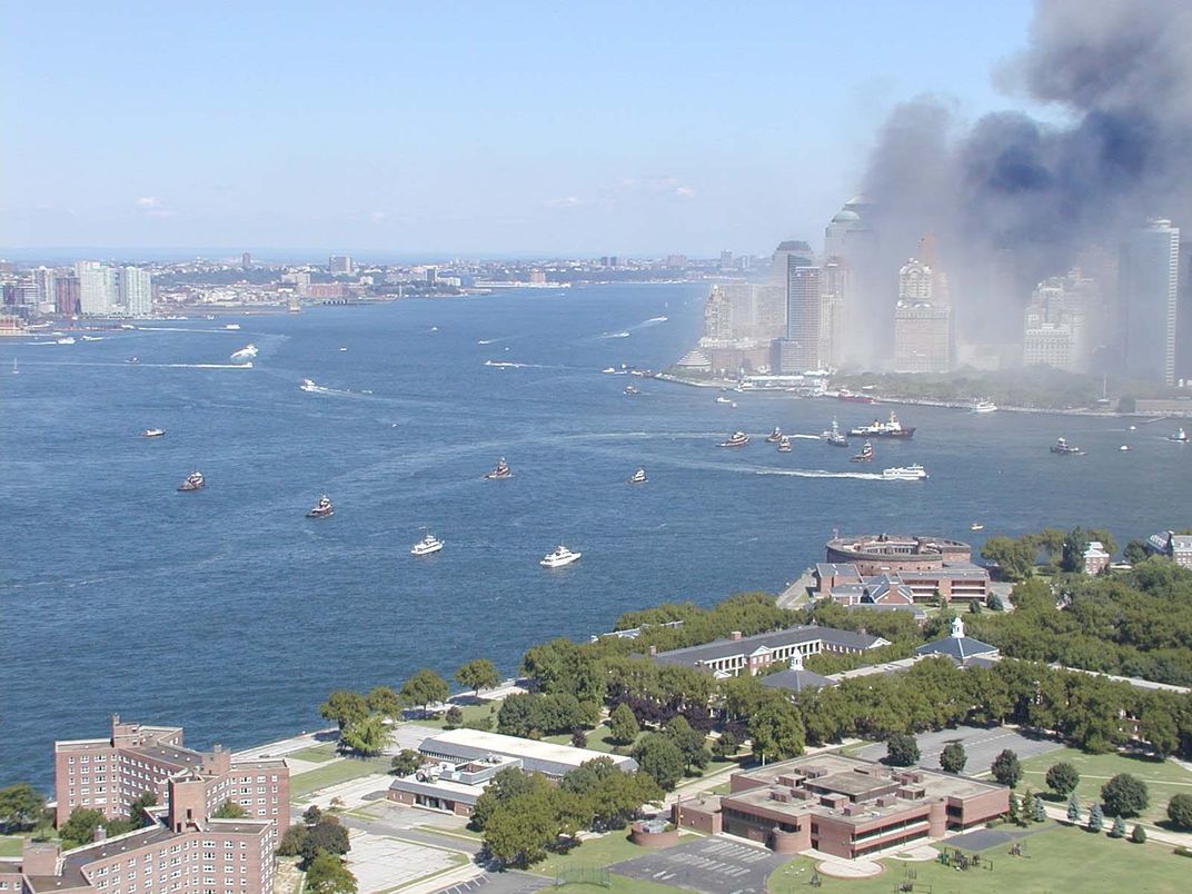 Manhattan with smoke, ships in the Bay