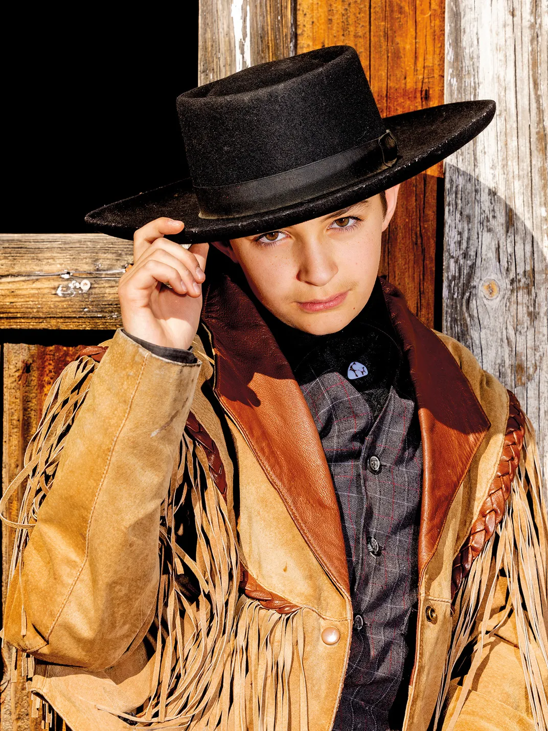 Evan Boatman, 13, is known for performing lively gunfights at the Saloon Theater on South Third Street.