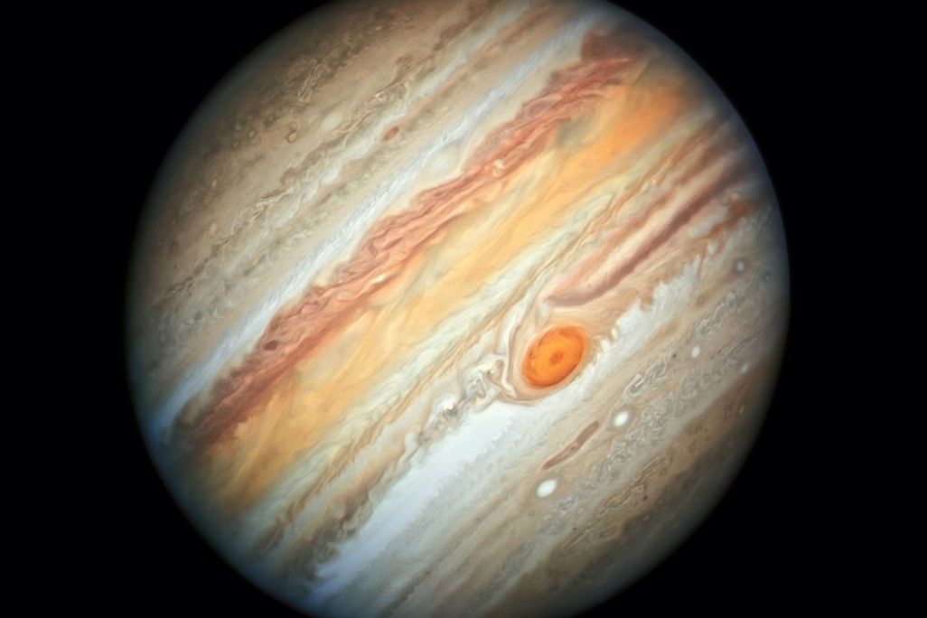 Jupiter, tilted, with its bands and Great Red Spot clearly visible