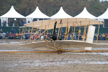 A reproduction Wright Flyer, with pilot Kevin Kochersberger,  was foiled by bad weather on this particular attempt on December 17, 2003. But it had already flown successfully to mark the 100th anniversary of Orville and Wilbur’s triumph.
