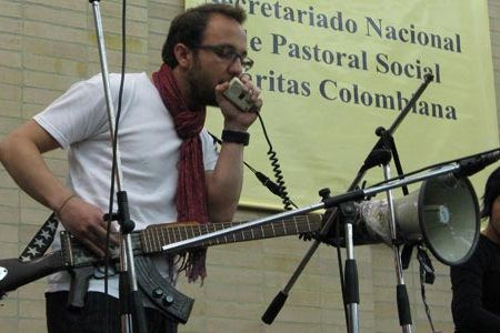 Cesar Lopez and cellist Sandra Parra perform in Bogota with his “escopetarra” at the launch of Colombia’s 2008 peace week