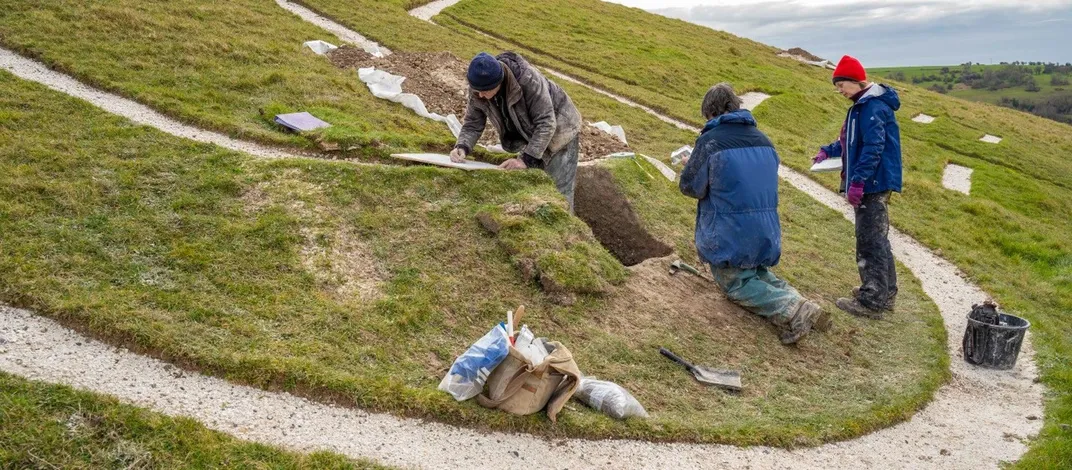 Researchers collect samples from the Cerne Abbas Giant