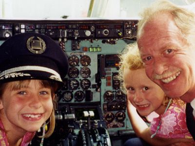 Sullenberger inside an MD-80 in 2001, with daughters Kate (left) and Kelly.