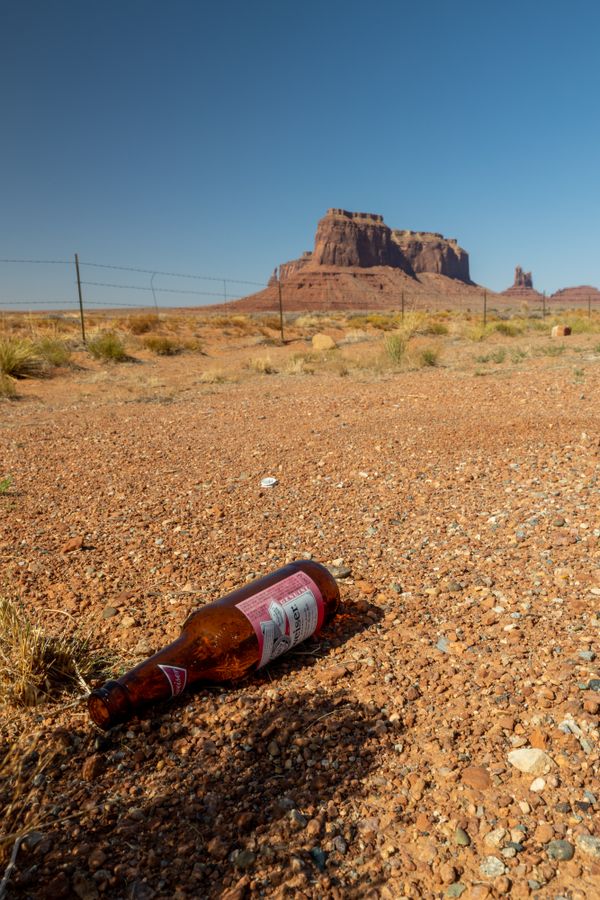 A beer bottle frames Monument Valley in the Navajo Nation thumbnail