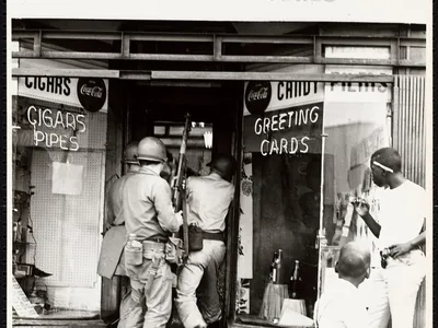 President Lyndon Johnson constituted the Kerner Commission to identify the genesis of the violent 1967 riots that killed 43 in Detroit and 26 in Newark (above, soldiers in a Newark storefront), while causing fewer casualties in 23 other cities. 