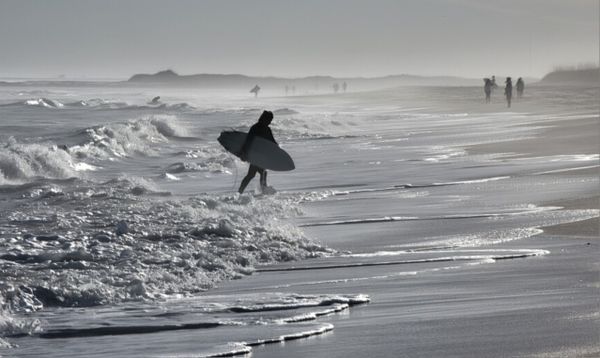 Surfer on Wrightsville Beach, North Carolina thumbnail