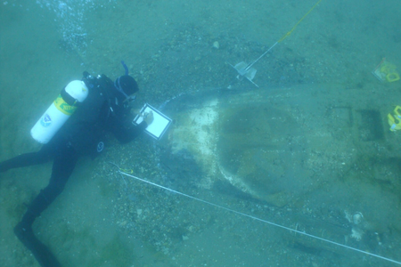 Researchers study wreckage from Moody&#39;s P-39 aircraft, which lies in pieces on the floor of Lake Huron.